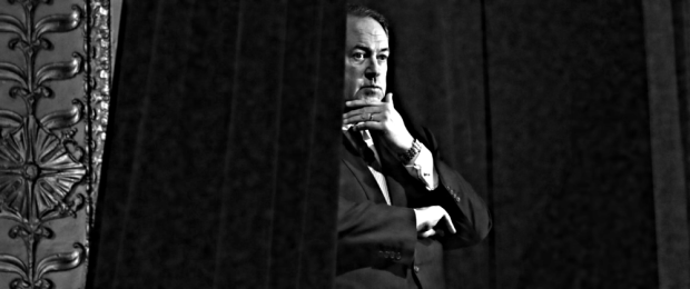 Former Arkansas Gov. Mike Huckabee waits backstage before speaking during the Freedom Summit Saturday, Jan. 24, 2015, in Des Moines, Iowa (AP Photo/Charlie Neibergall)