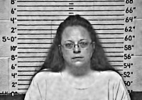 Rowan County Clerk Kim Davis, in a mugshot, 3 September 2015, after being held in contempt of court by U.S. District Judge David Bunning, after she refused to comply with the law and issue marriage licenses to homosexual couples.