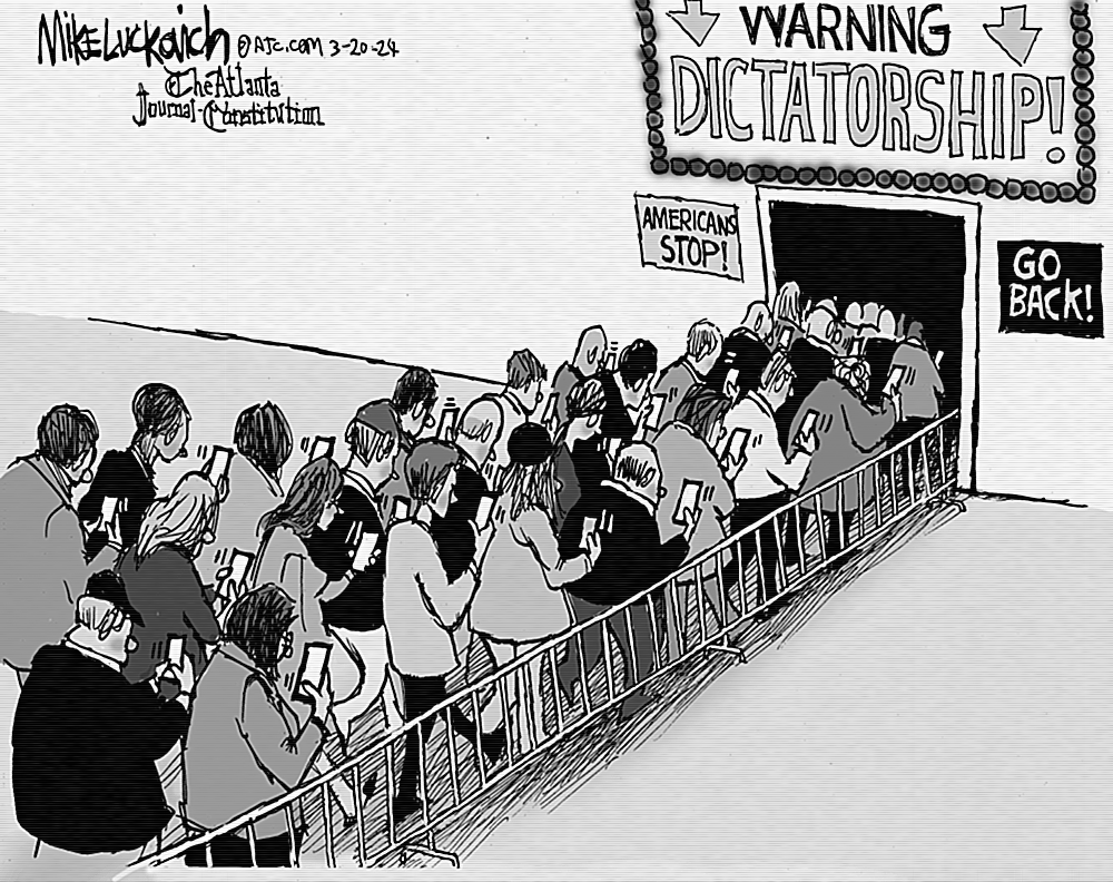 Mike Luckovich, The Atlanta Journal Constitution, 20 March 2024 - Signs declare, 'Warning Dictatorship!', 'Americans Stop!' and 'Go Back!', as people fail to notice, dutifully filing through the door as they watch their mobile phones.